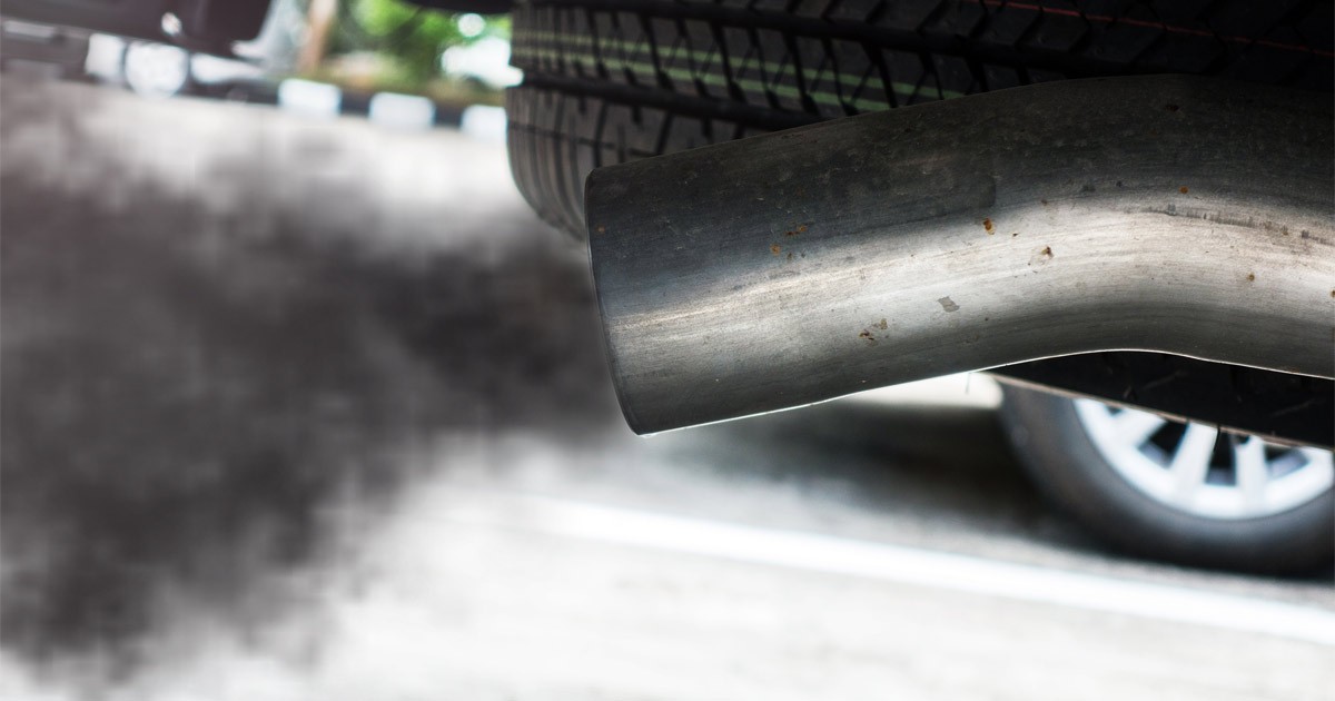 Exhaust pipe on car with pollutant coming out