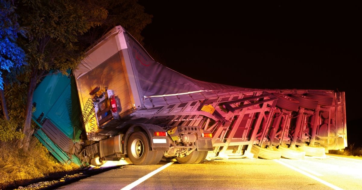 a truck flipped over on the road