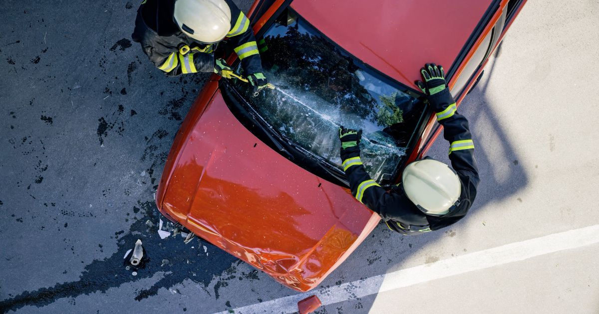 first responders trying to save car accident victims